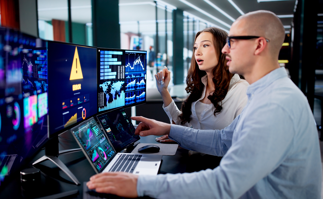 Security operations team monitoring cyber threats in a control room.