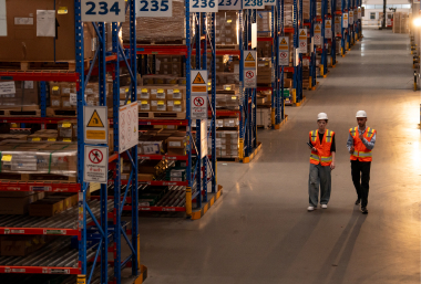 workers walking in a huge warehouse