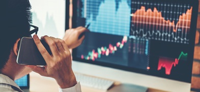 Digital financial data and market indicators representing improved uptime and operational resilience.
