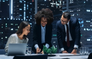 people collaborating on laptop