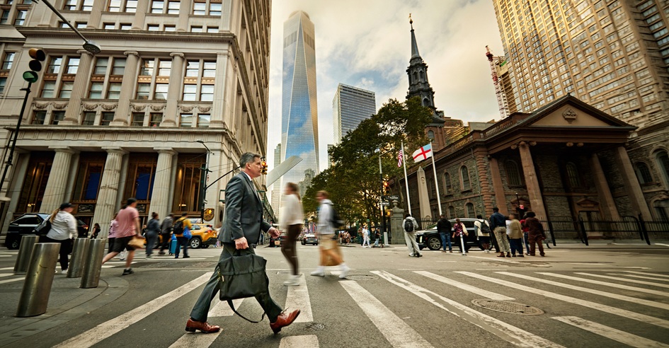 Street view with people walking and crossing zebra lines