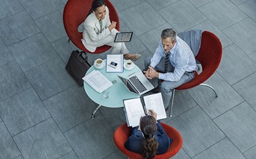 3 people discussing work