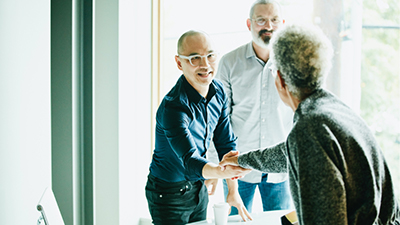 man and women shaking hands