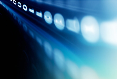 Abstract image of blurred circular lights on a blue background, suggesting speed and digital data