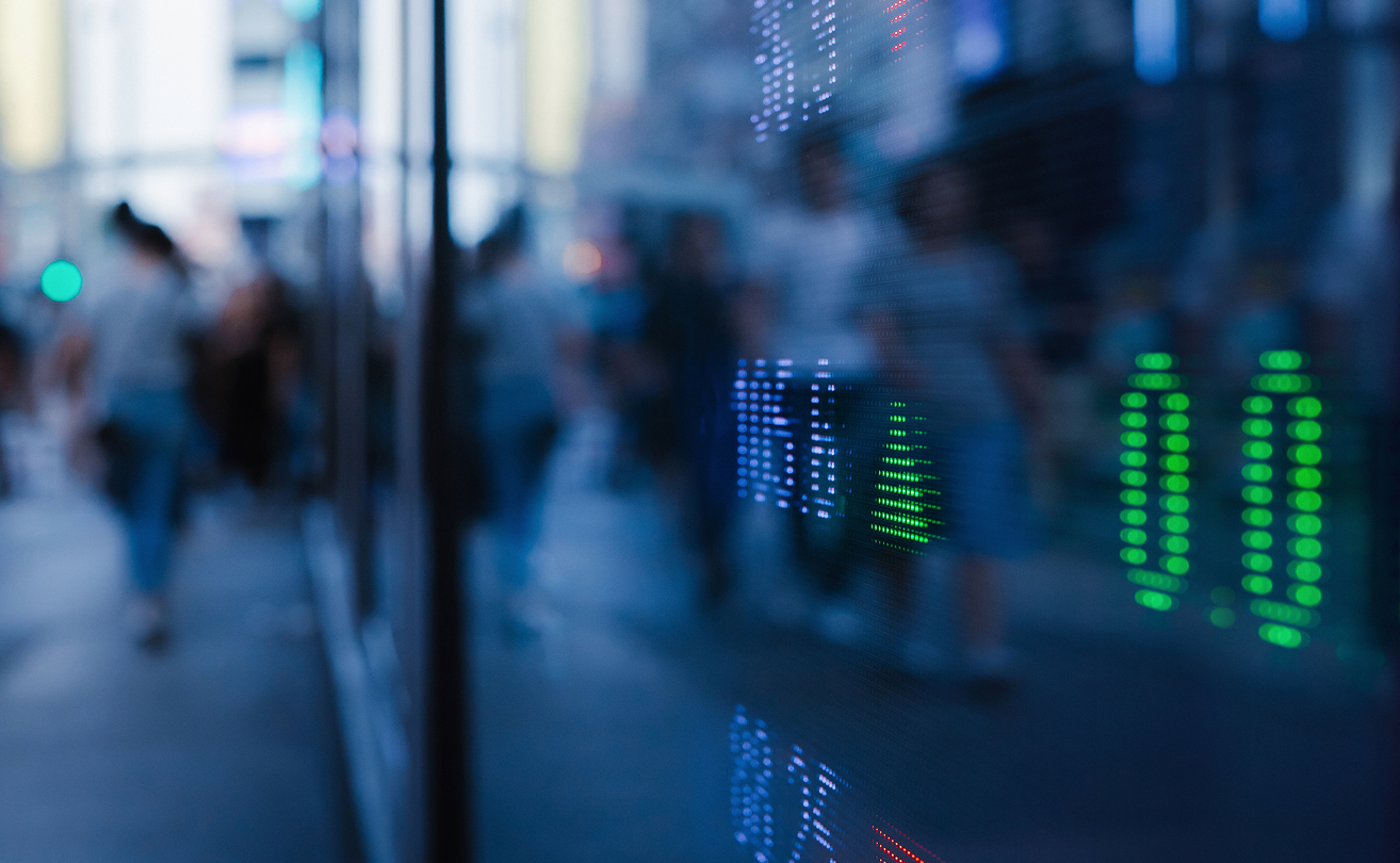 Blurred business environment with digital analytics overlay representing operational cost optimization.