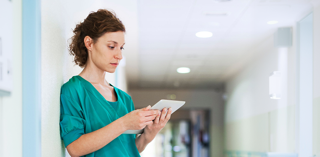 medical staff checking something on a tab